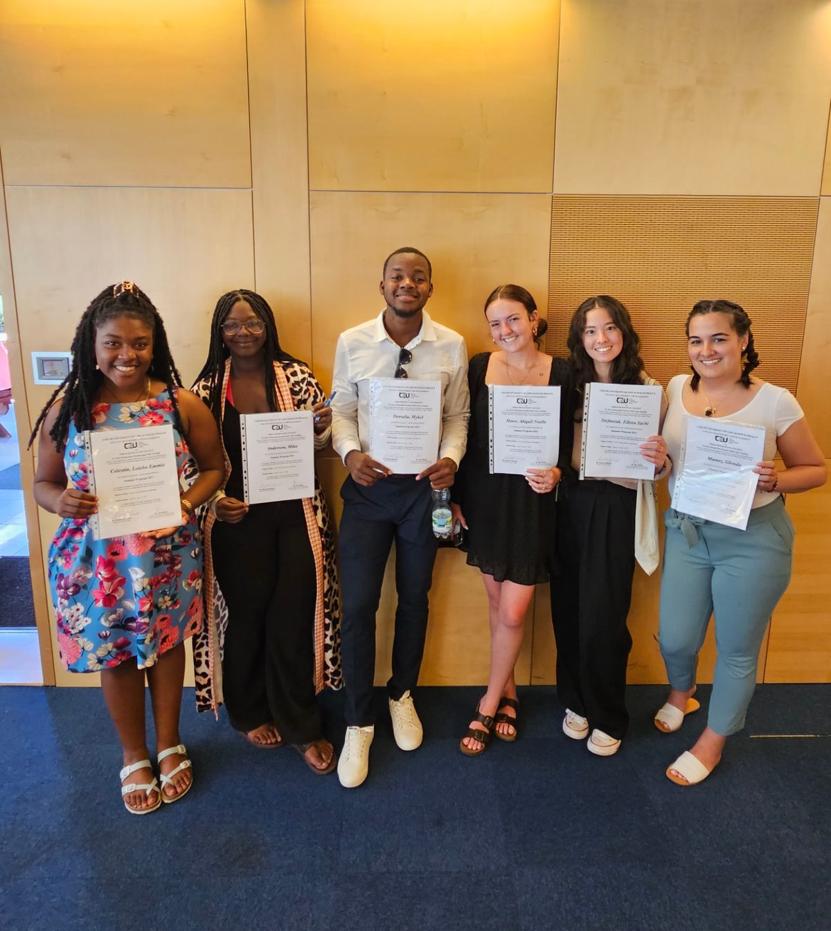 TTY students holding the program certificates they receive each year