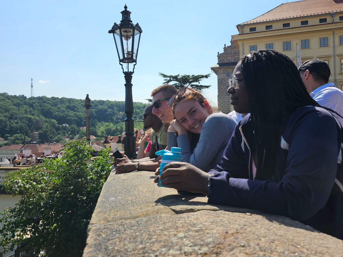 TTY students looking out over the city from a historic stone overlook